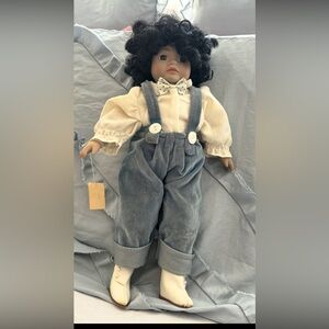 Vintage Porcelain Doll with Blue Overalls